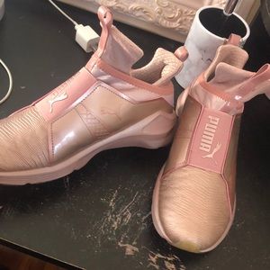 Kylie Jenner pink puma shoes.